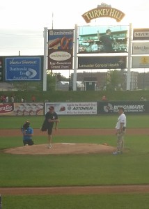John Throwing First Pitch - 01A